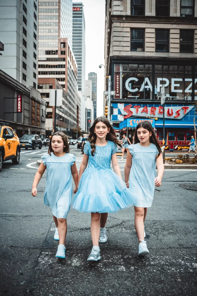 bat mitzvah girls taking pictures in Times Square