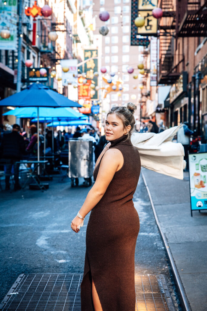 girl posing in china town for a history photo tour in New York City