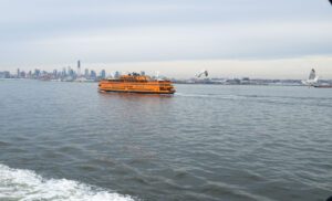 orange boat in nyc on the eat river 